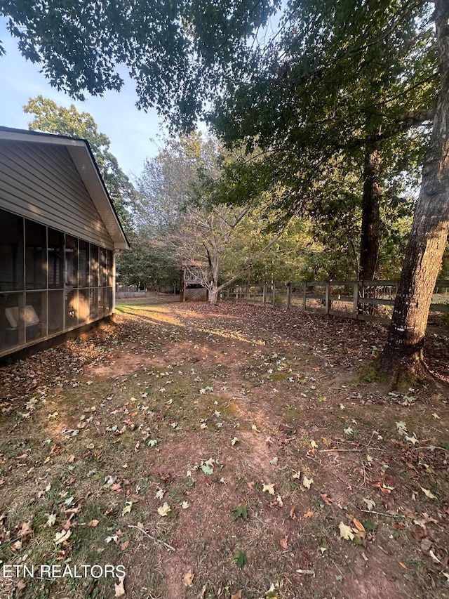 view of yard with a sunroom