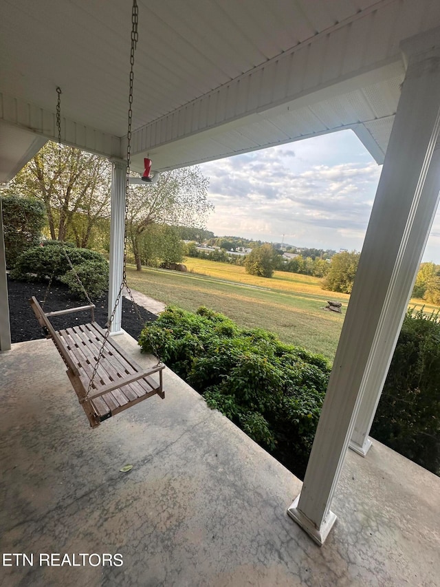 view of patio / terrace with a rural view