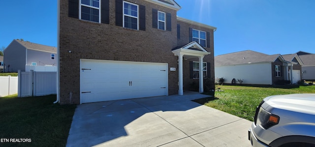 view of home's exterior with a garage and a yard