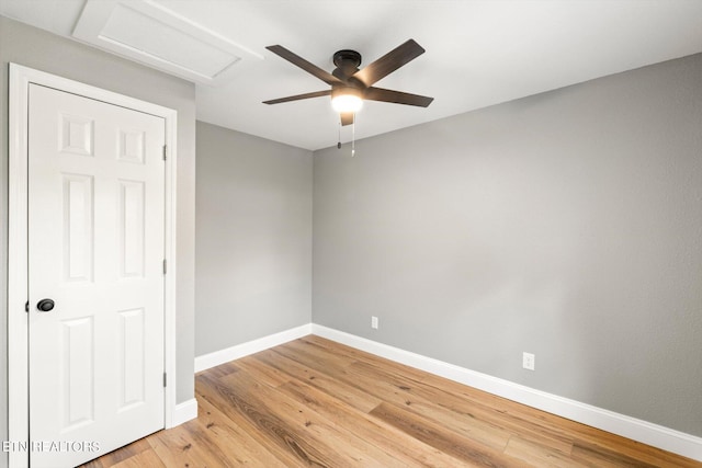 spare room with wood-type flooring and ceiling fan