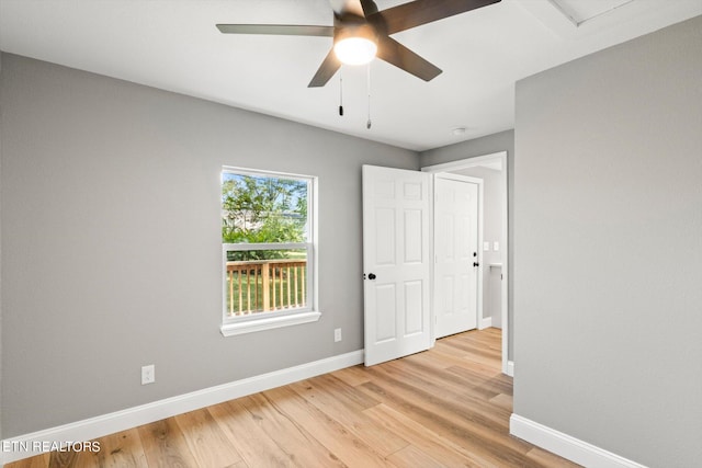 unfurnished room featuring light wood-type flooring and ceiling fan