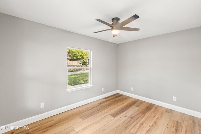 empty room featuring ceiling fan and light hardwood / wood-style flooring