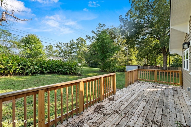 wooden deck with a yard