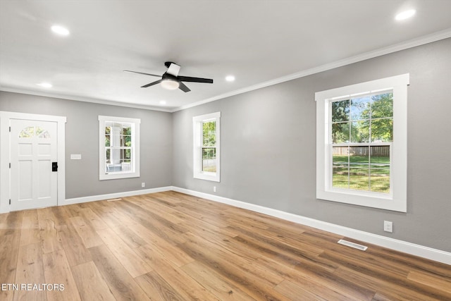 interior space featuring ceiling fan, light hardwood / wood-style floors, and a healthy amount of sunlight