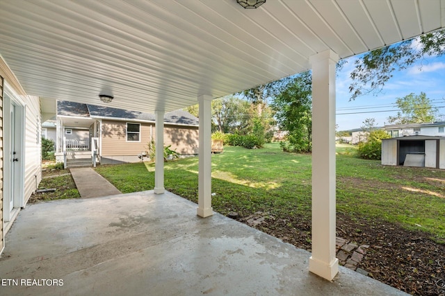 view of patio with an outdoor structure