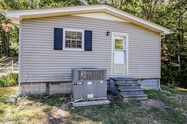 view of property exterior with central AC