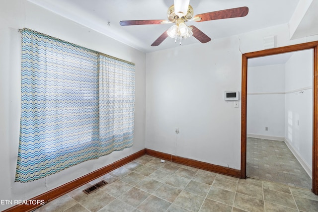 unfurnished room with ceiling fan