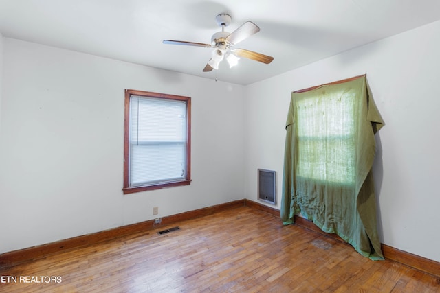 unfurnished room with ceiling fan and light hardwood / wood-style floors