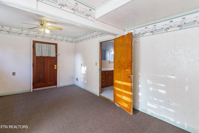 unfurnished room featuring carpet floors and ceiling fan