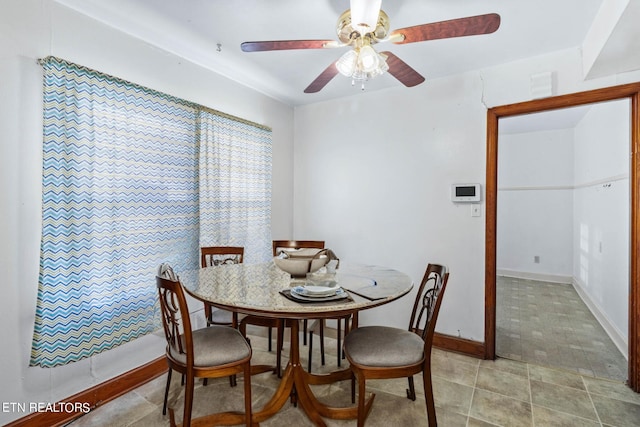 dining room featuring ceiling fan