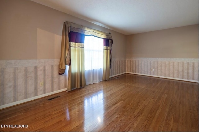 spare room featuring hardwood / wood-style flooring