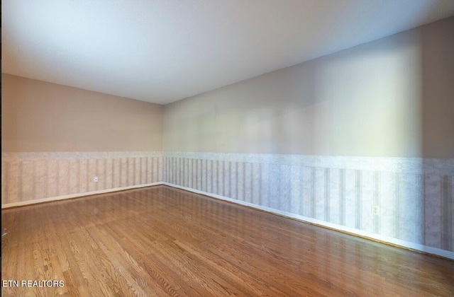 unfurnished room featuring hardwood / wood-style floors