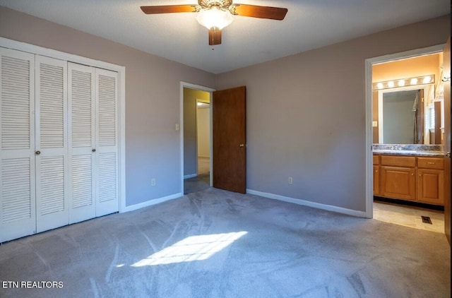 unfurnished bedroom with light carpet, a closet, and ceiling fan