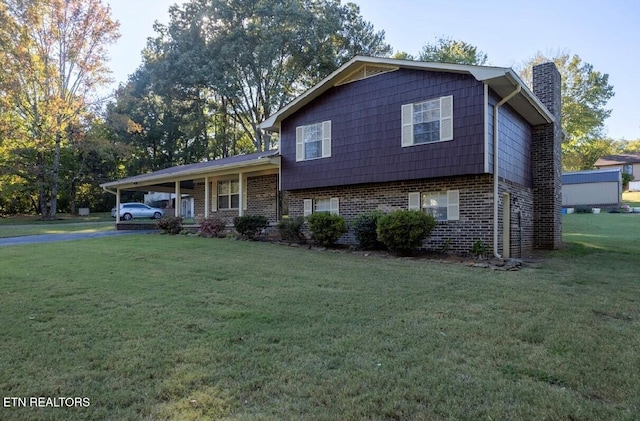 tri-level home with a carport and a front lawn