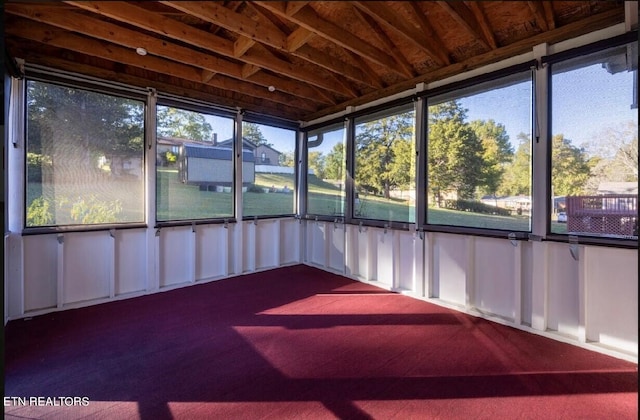 unfurnished sunroom with plenty of natural light