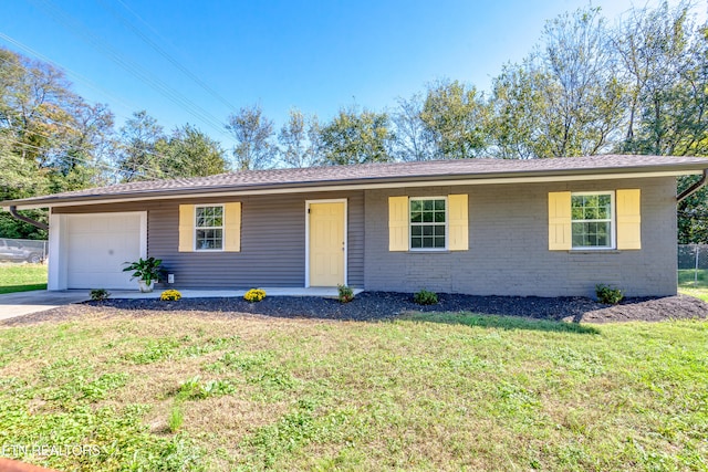 single story home featuring a front yard and a garage