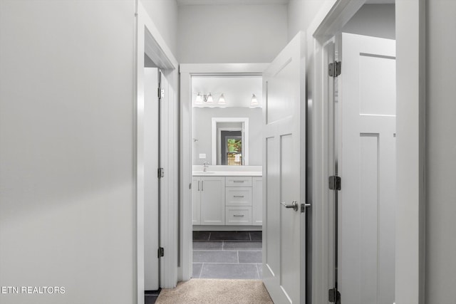 corridor with tile patterned flooring