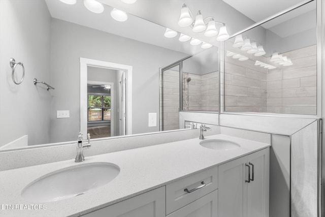 bathroom featuring walk in shower and vanity