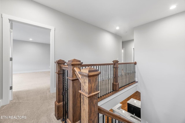 corridor with light colored carpet