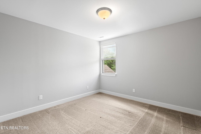 unfurnished room featuring carpet flooring