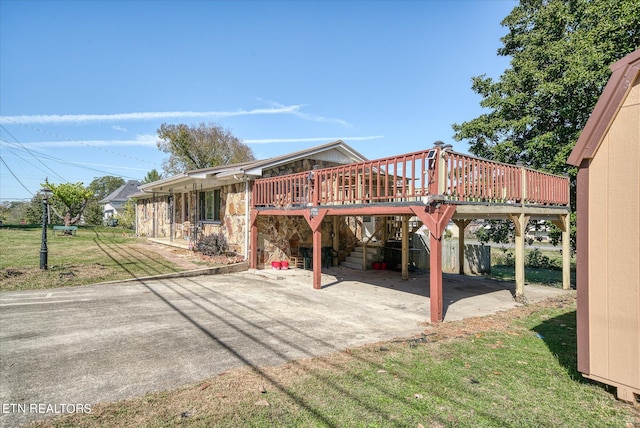 view of patio featuring a deck and a carport