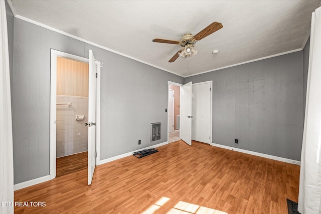 unfurnished bedroom with ceiling fan, crown molding, and light wood-type flooring