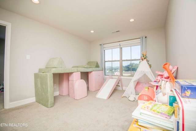 bedroom with light colored carpet