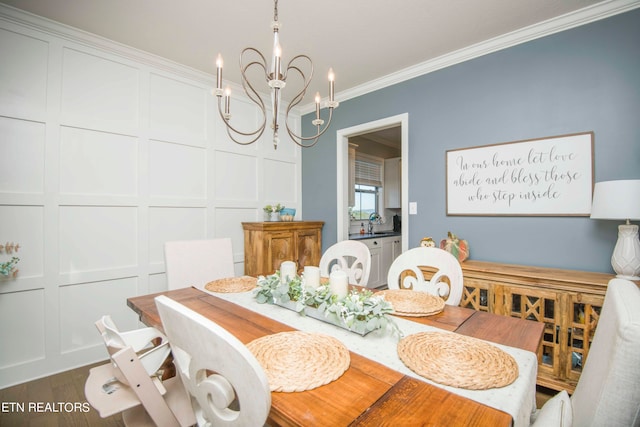 dining area with a notable chandelier, crown molding, and dark hardwood / wood-style flooring