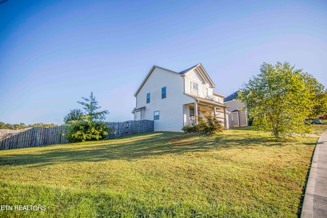 view of property exterior with a yard