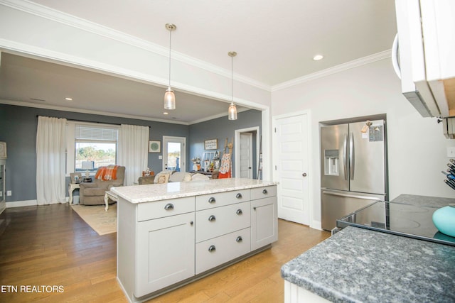 kitchen featuring light wood-type flooring, decorative light fixtures, white cabinetry, stainless steel refrigerator with ice dispenser, and light stone countertops