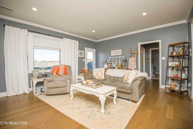 living room featuring ornamental molding and dark hardwood / wood-style flooring