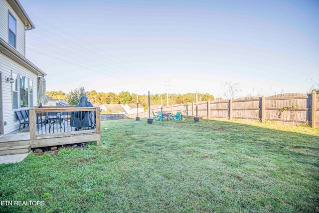 view of yard featuring a wooden deck