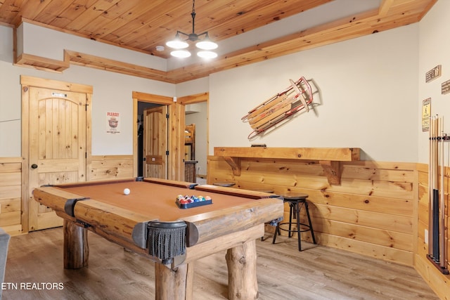 game room featuring billiards, wooden walls, hardwood / wood-style floors, and wood ceiling