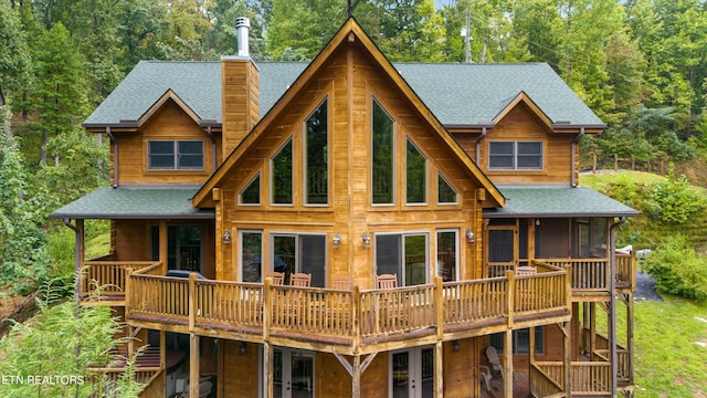 rear view of house with a deck