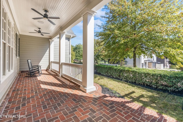 view of patio / terrace with ceiling fan and a porch