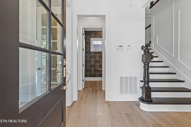 foyer with light hardwood / wood-style floors