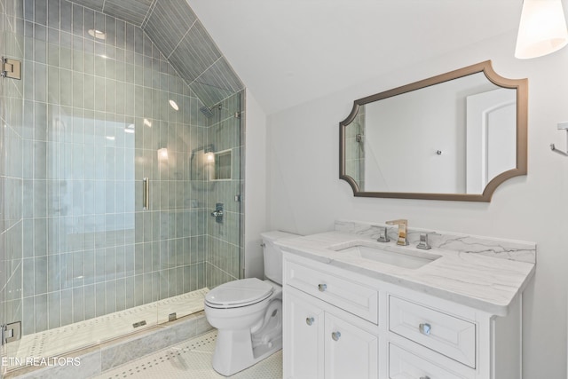 bathroom with tile patterned floors, vaulted ceiling, toilet, a shower with door, and vanity