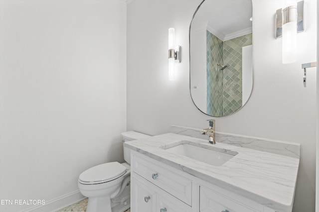 bathroom with vanity, toilet, ornamental molding, and a shower