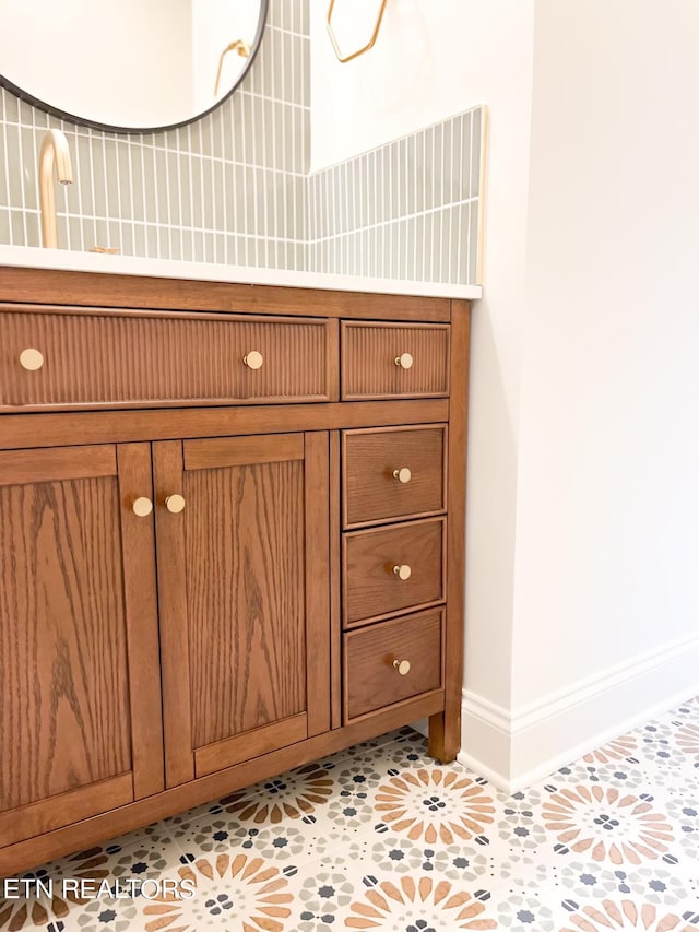 bathroom featuring tile patterned floors and backsplash