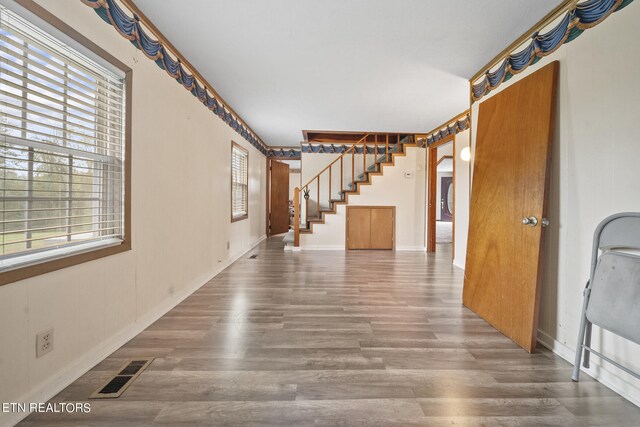 9832 Clift Rd, Strawberry Plains, TN 37871 - interior space featuring a healthy amount of sunlight, wood finished floors, visible vents, and stairs