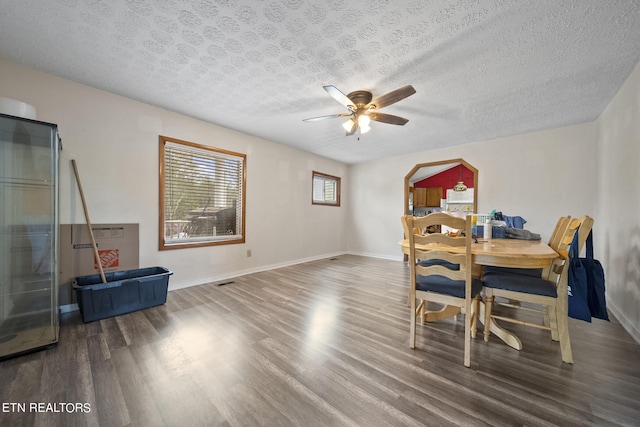 9832 Clift Rd, Strawberry Plains, TN 37871 - dining area featuring a textured ceiling, wood finished floors, baseboards, and a ceiling fan