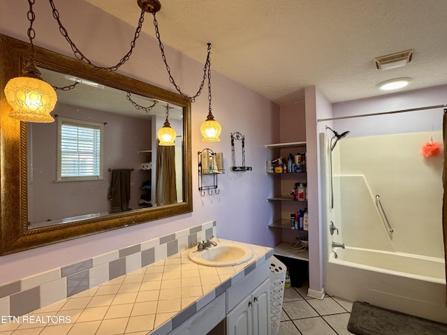 9832 Clift Rd, Strawberry Plains, TN 37871 - full bathroom featuring washtub / shower combination, vanity, tile patterned flooring, a textured ceiling, and visible vents