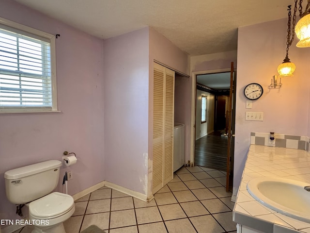 9832 Clift Rd, Strawberry Plains, TN 37871 - bathroom with baseboards, toilet, a textured ceiling, vanity, and tile patterned floors