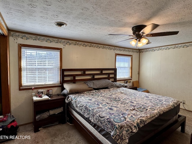 9832 Clift Rd, Strawberry Plains, TN 37871 - carpeted bedroom with a ceiling fan, a textured ceiling, and ornamental molding