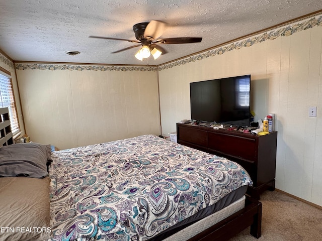 9832 Clift Rd, Strawberry Plains, TN 37871 - carpeted bedroom with a textured ceiling, a ceiling fan, and ornamental molding