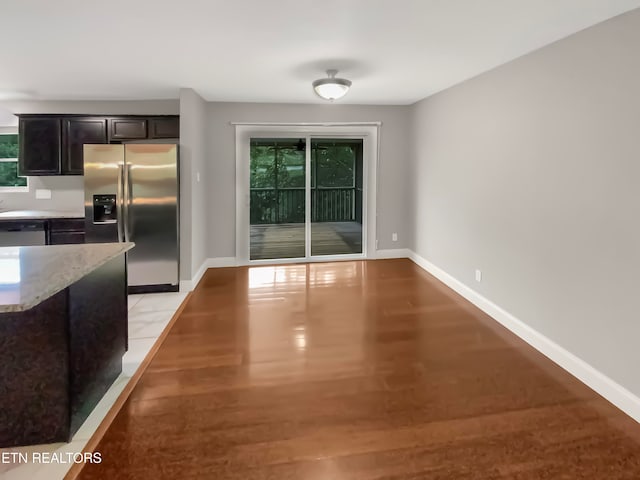 unfurnished dining area with light wood-type flooring