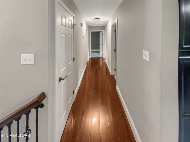 hall with dark hardwood / wood-style floors