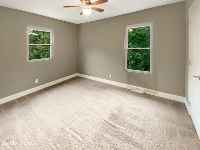 empty room featuring carpet and ceiling fan