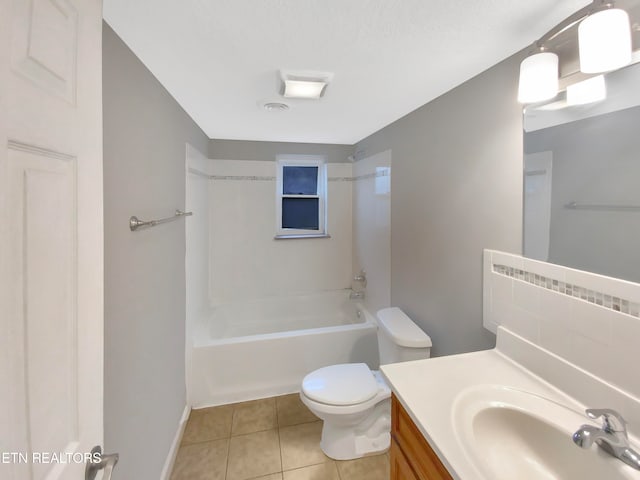 full bathroom with vanity, tile patterned flooring, toilet, and shower / washtub combination