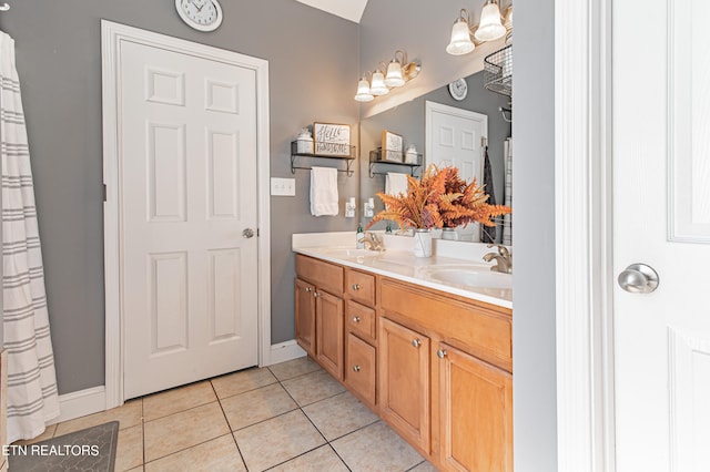 bathroom with tile patterned floors and vanity